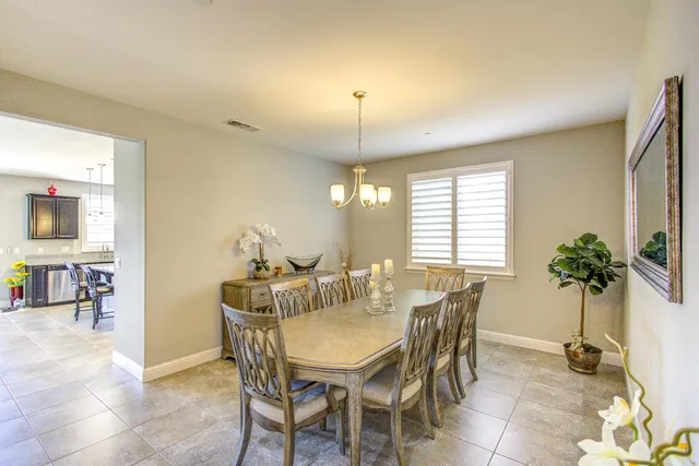 a kitchen with a stove a sink and a refrigerator