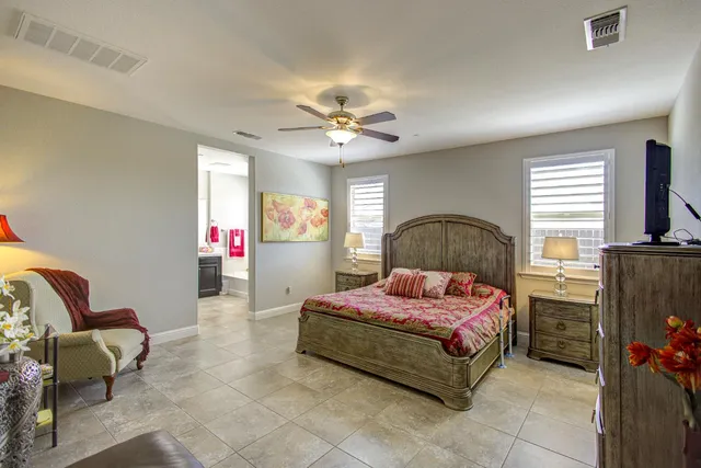 a bathroom with a tub sink shower and mirror