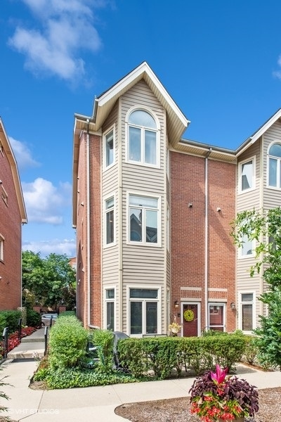 1231 West Fletcher Street, Unit A Chicago, IL 60657 - Photo 1 of 20 a front view of a house with a yard