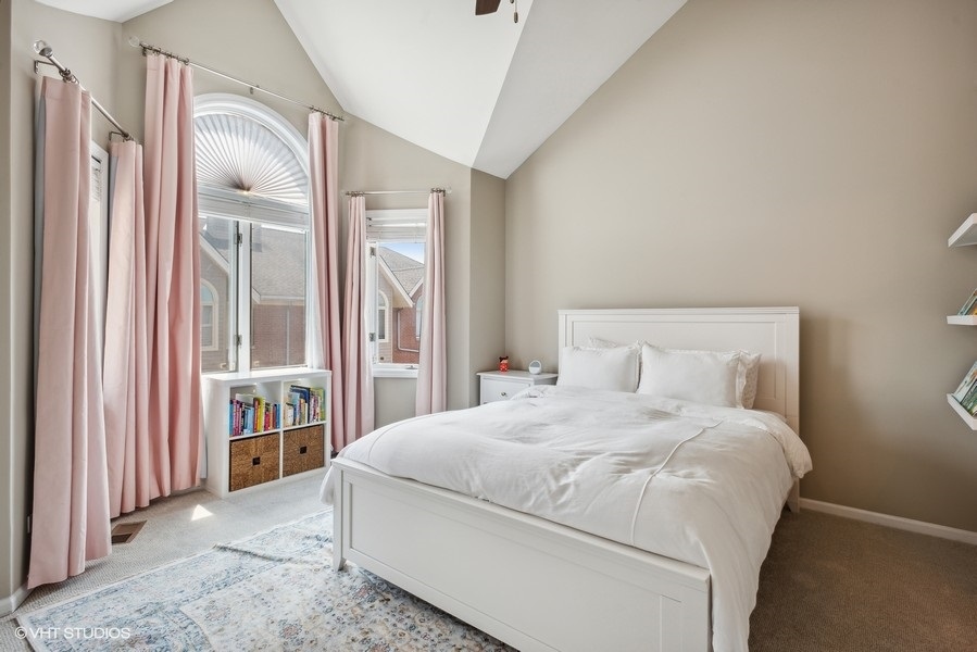 1231 West Fletcher Street, Unit A Chicago, IL 60657 - Photo 12 of 20 a bedroom with a large bed and a window