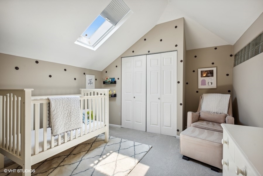 1231 West Fletcher Street, Unit A Chicago, IL 60657 - Photo 13 of 20 a living room with furniture and a large window