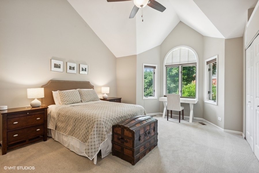 1231 West Fletcher Street, Unit A Chicago, IL 60657 - Photo 8 of 20 a spacious bedroom with a bed and a table