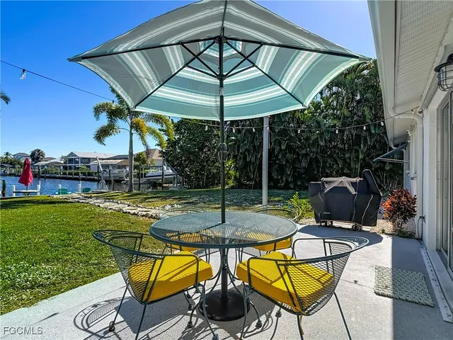 a view of a swimming pool with a patio