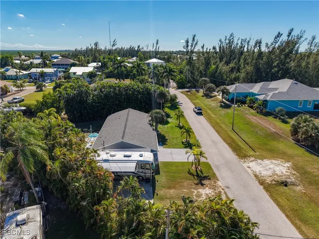 an aerial view of a house with a garden