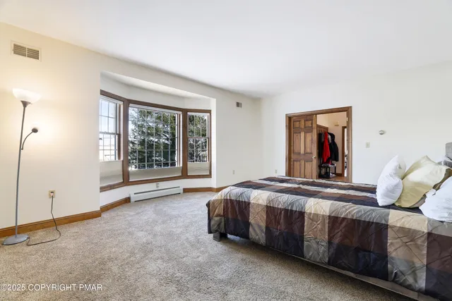 a bedroom with a bed and furniture