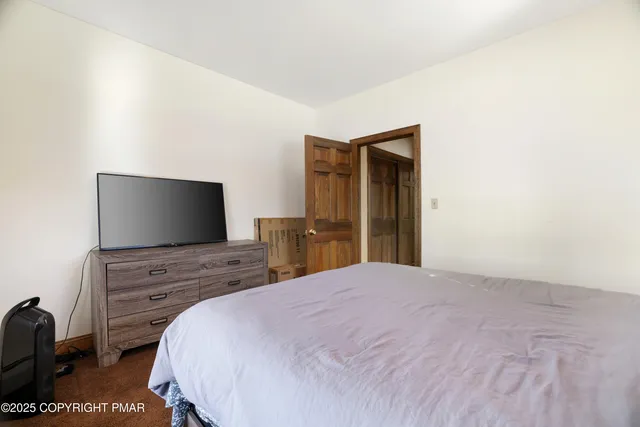 a bathroom with a bathtub and shower