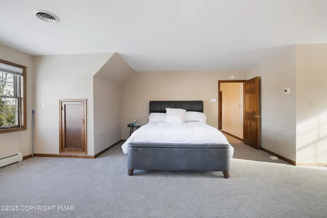 a bathroom with a sink a large mirror and a toilet