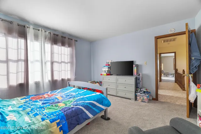 a view of a building with a snow on the road