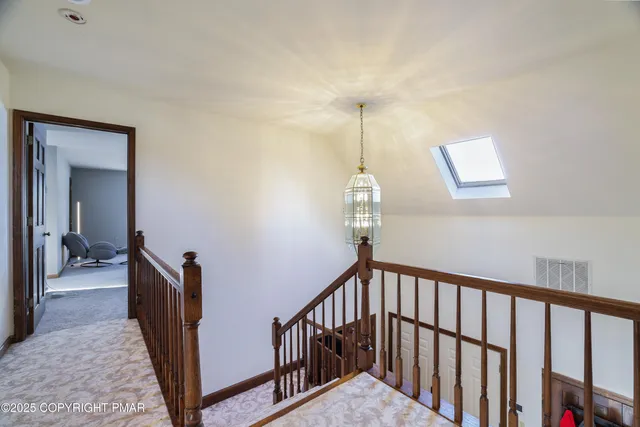 a view of house with snow on the road