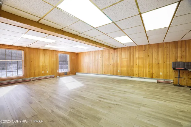 a view of yard covered with snow in front of house