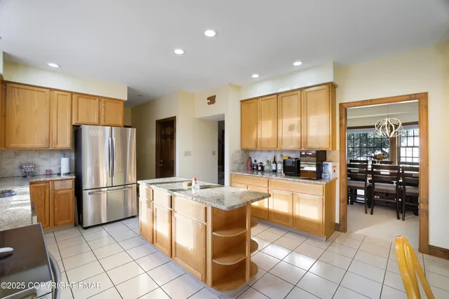 a kitchen with sink a window and cabinets