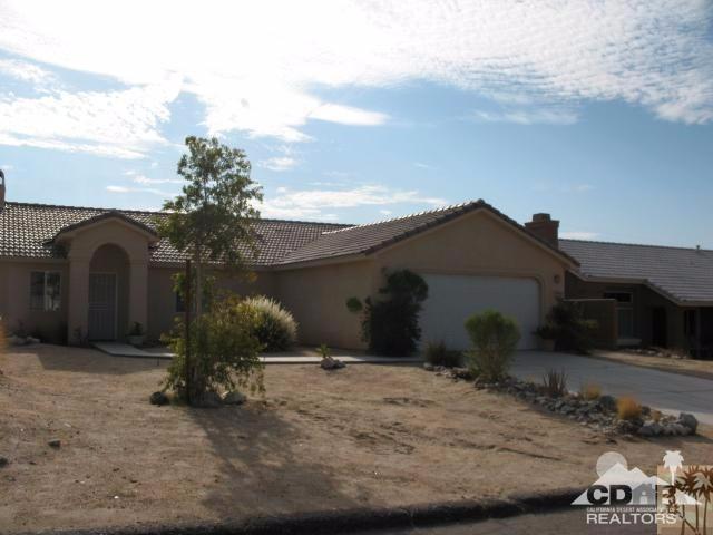 10762 San Pablo Road Desert Hot Springs, CA 92240 - Photo 2 of 9 a view of a house with a yard