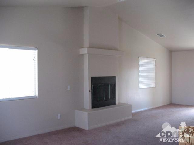 10762 San Pablo Road Desert Hot Springs, CA 92240 - Photo 5 of 9 a living room with furniture and a window