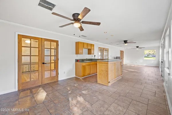 a view of livingroom with furniture ceiling fan and window