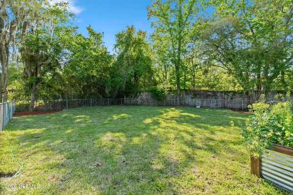 a view of house with a yard