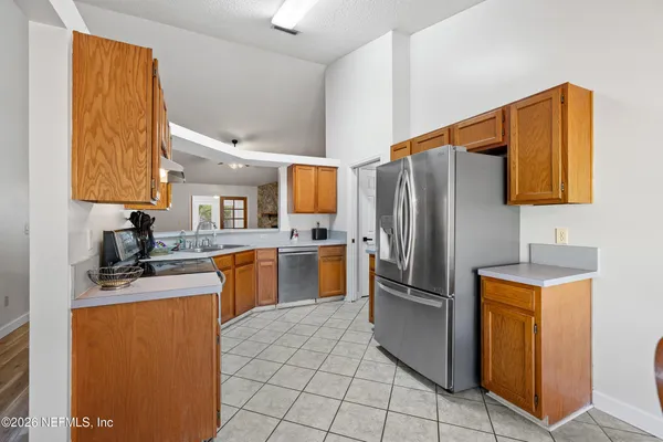a kitchen with a refrigerator sink and microwave