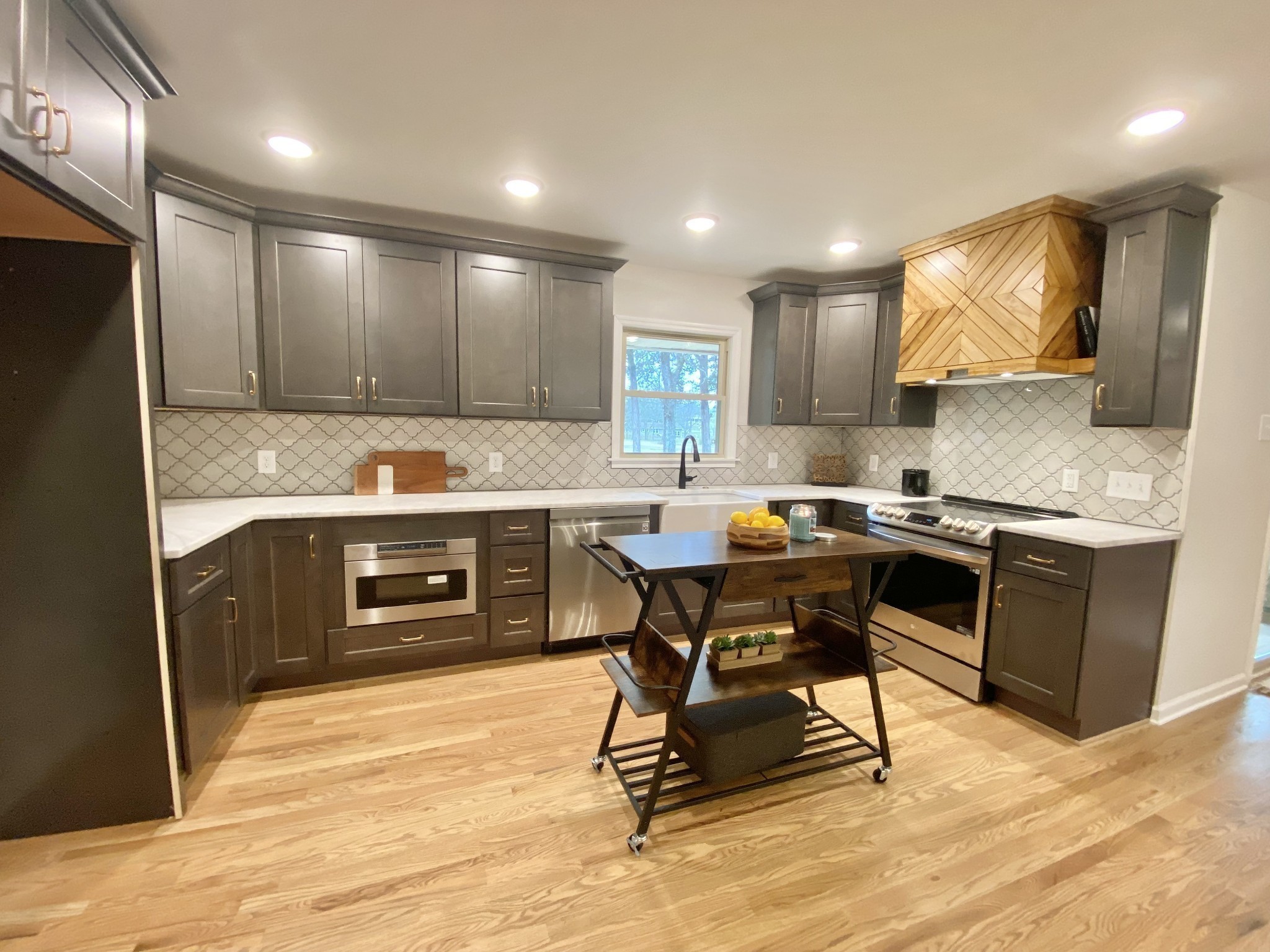 218 Windmill Drive Lebanon, TN 37087 - Photo 22 of 70 a kitchen with kitchen island granite countertop wooden cabinets and counter space