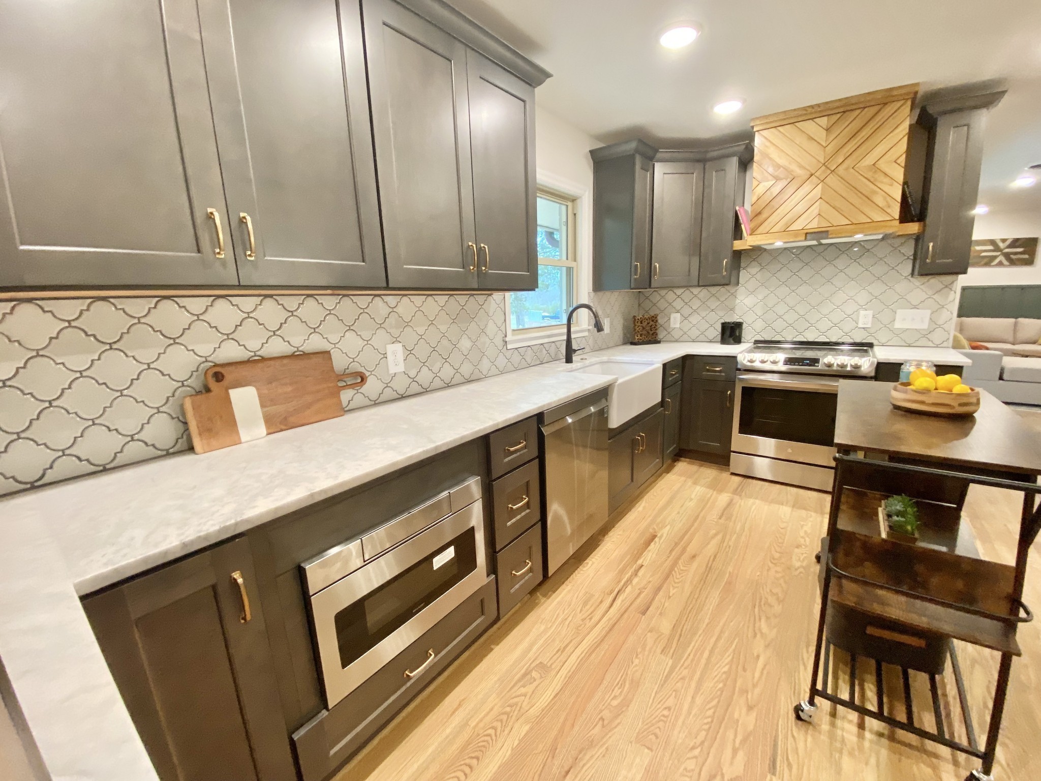 218 Windmill Drive Lebanon, TN 37087 - Photo 23 of 70 a kitchen with stainless steel appliances granite countertop a sink stove and refrigerator