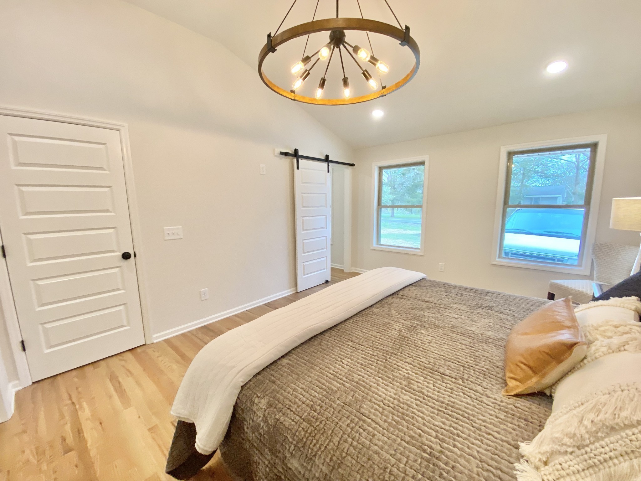 218 Windmill Drive Lebanon, TN 37087 - Photo 43 of 70 a bedroom with a bed and a chandelier