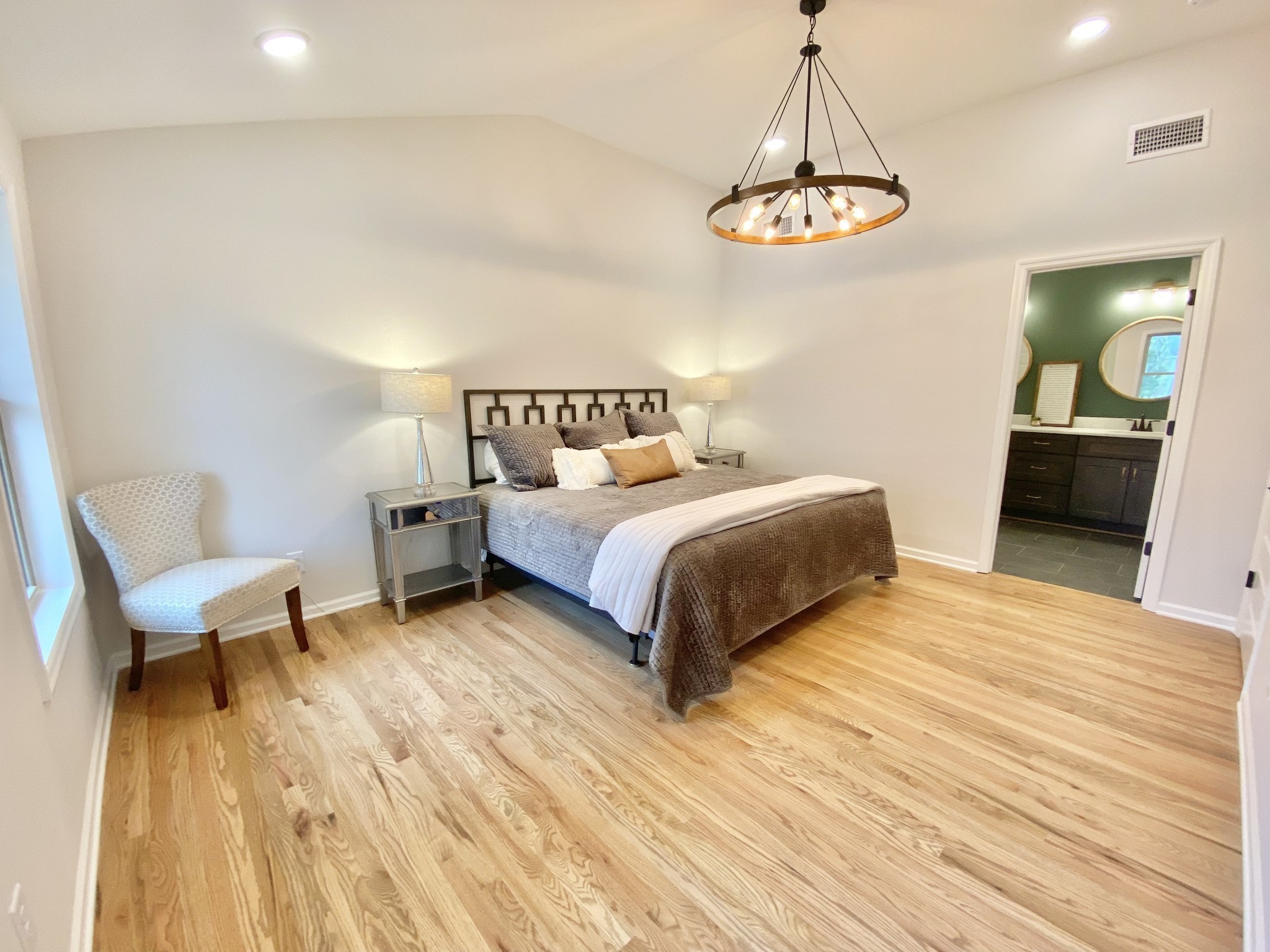 218 Windmill Drive Lebanon, TN 37087 - Photo 45 of 70 a bedroom with a bed and a chandelier