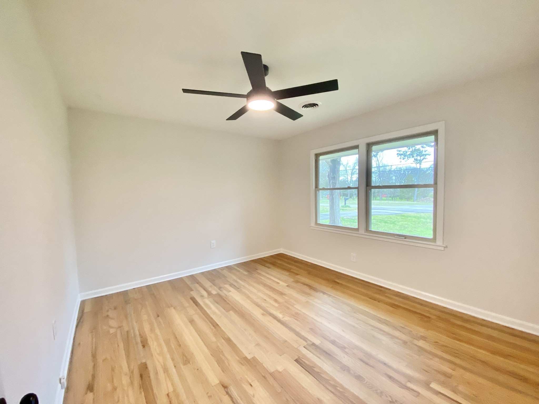 218 Windmill Drive Lebanon, TN 37087 - Photo 54 of 70 wooden floor in an empty room with a window