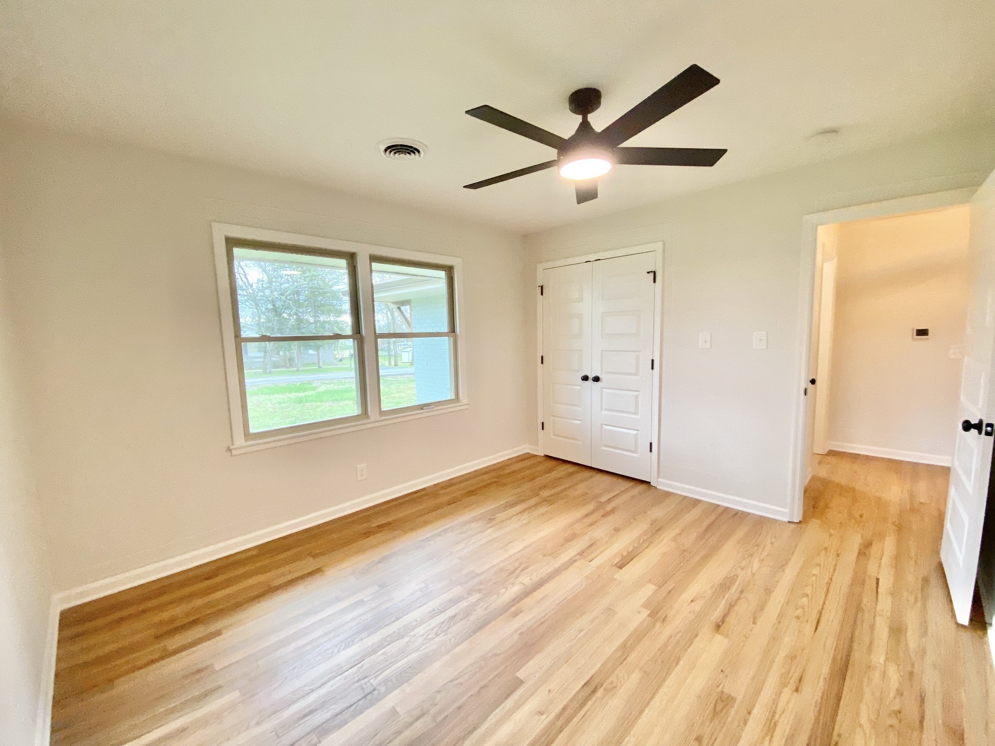 218 Windmill Drive Lebanon, TN 37087 - Photo 55 of 70 wooden floor in an empty room with a window