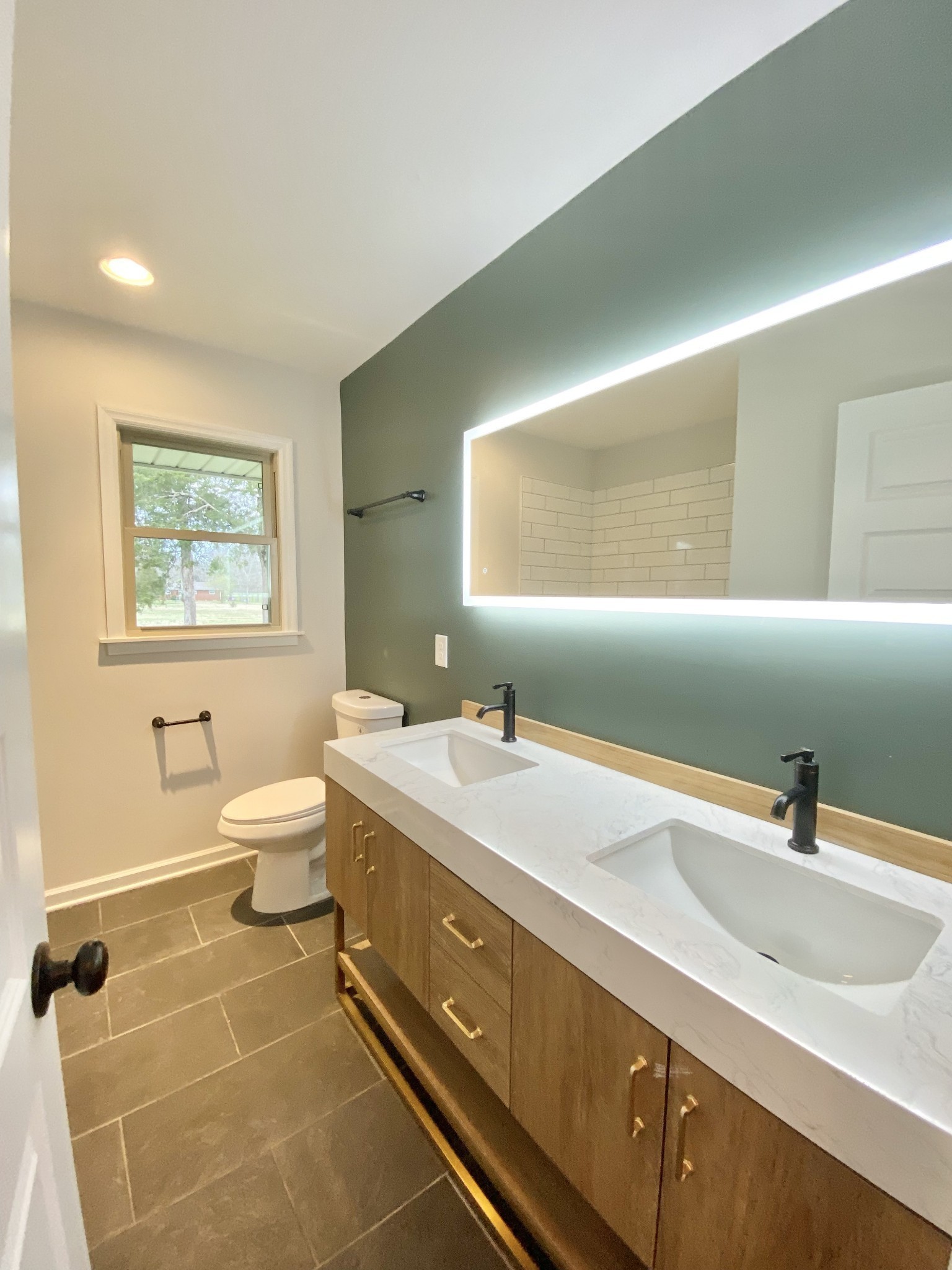 218 Windmill Drive Lebanon, TN 37087 - Photo 56 of 70 a bathroom with a double vanity sink toilet and a mirror