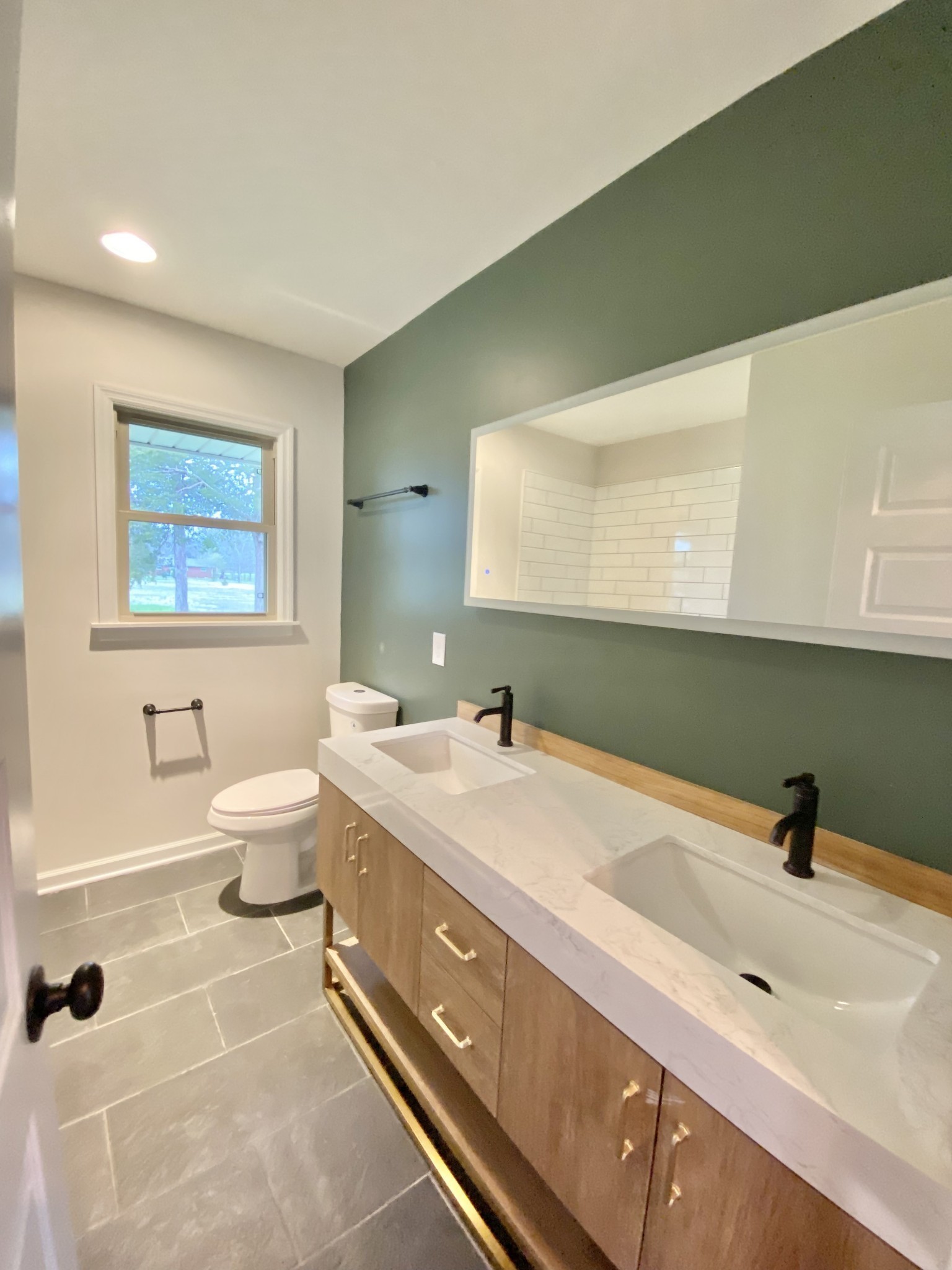 218 Windmill Drive Lebanon, TN 37087 - Photo 57 of 70 a spacious bathroom with a sink a toilet and a mirror