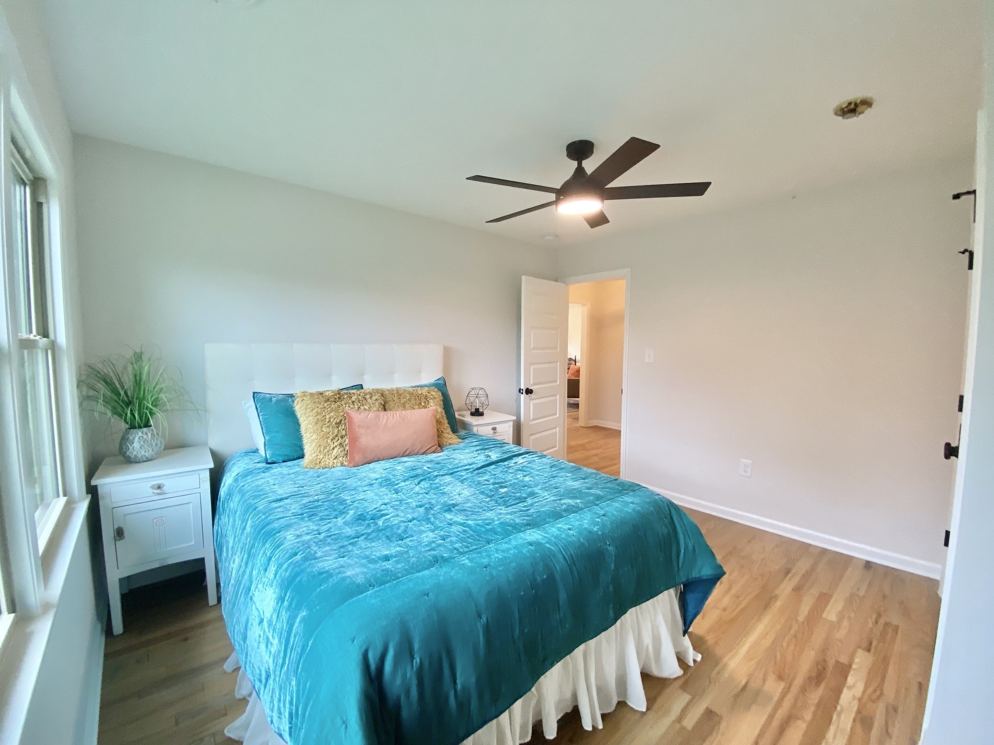 218 Windmill Drive Lebanon, TN 37087 - Photo 63 of 70 a bedroom with a bed and a chandelier