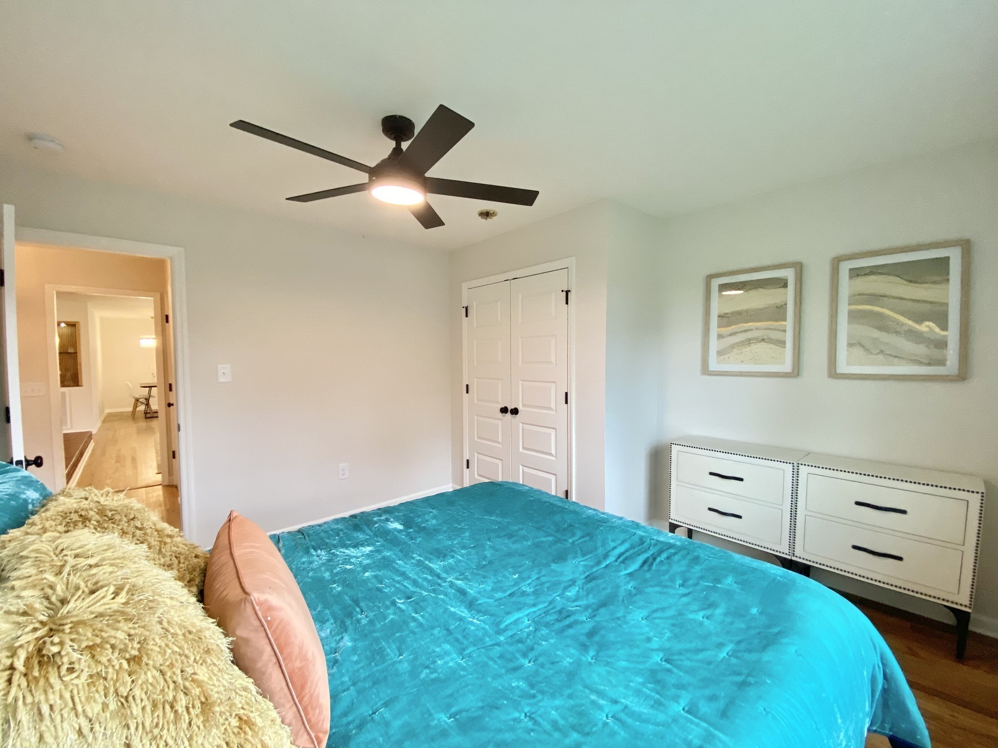 218 Windmill Drive Lebanon, TN 37087 - Photo 64 of 70 a bedroom with a large bed and a chandelier