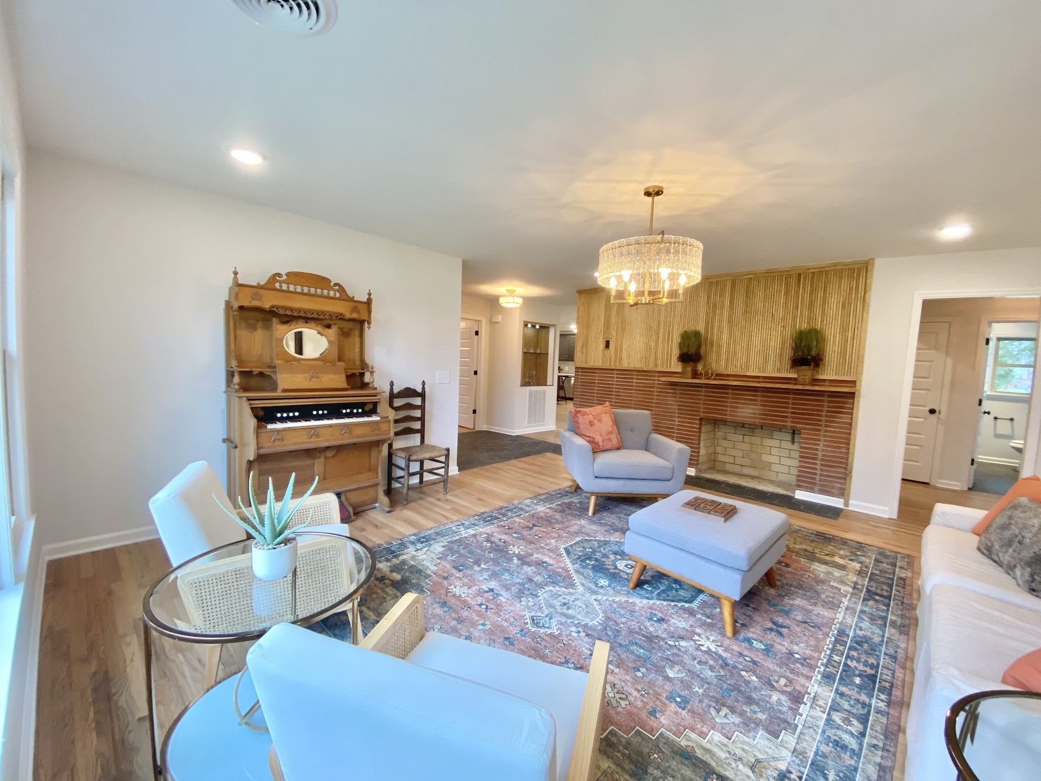218 Windmill Drive Lebanon, TN 37087 - Photo 8 of 70 a living room with furniture a fireplace and a chandelier