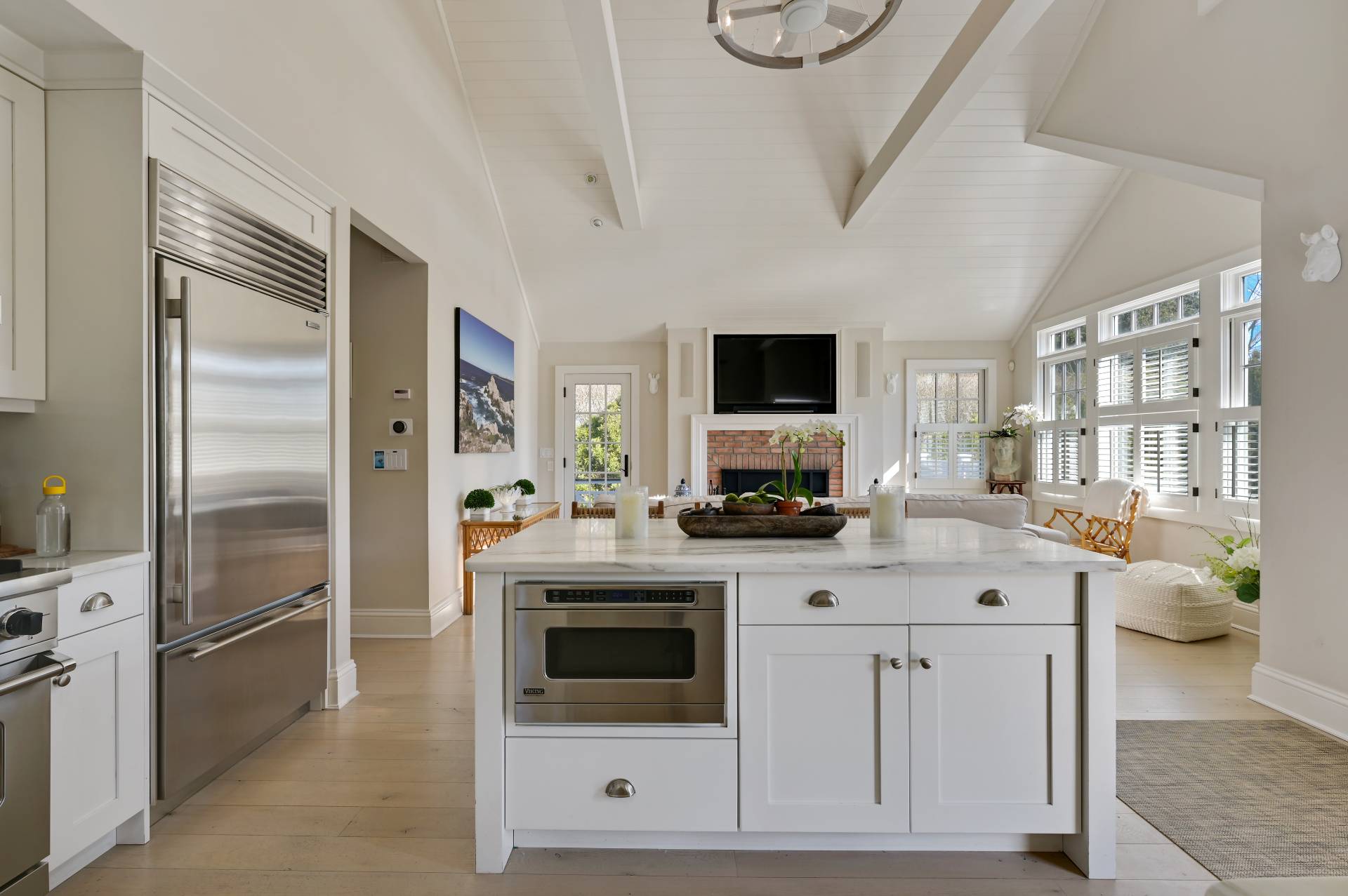 5 Ridge Drive Sag Harbor, NY 11963 - Photo 6 of 27 a kitchen with white cabinets and stainless steel appliances