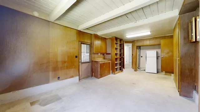 a view of a house with snow on the background