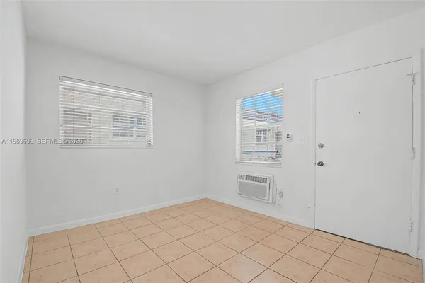 a view of an empty room with windows