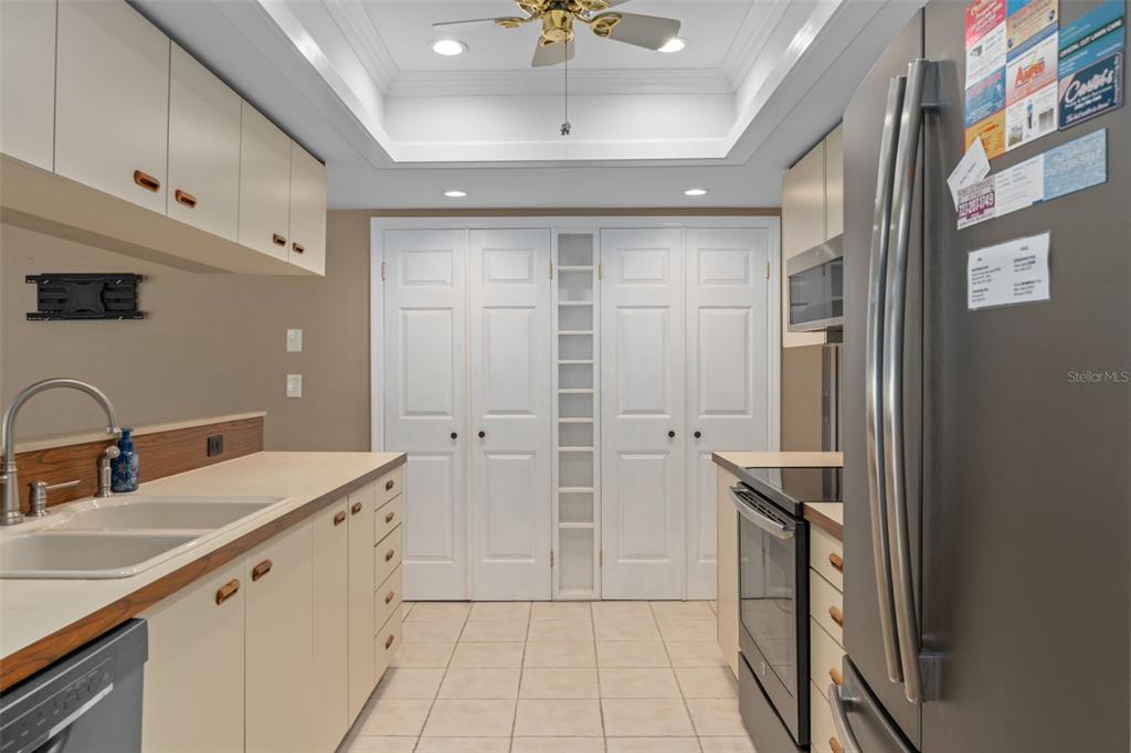 3217 Abeline Road Spring Hill, FL 34608 - Photo 20 of 48 a spacious bathroom with a double vanity sink a mirror and a shower