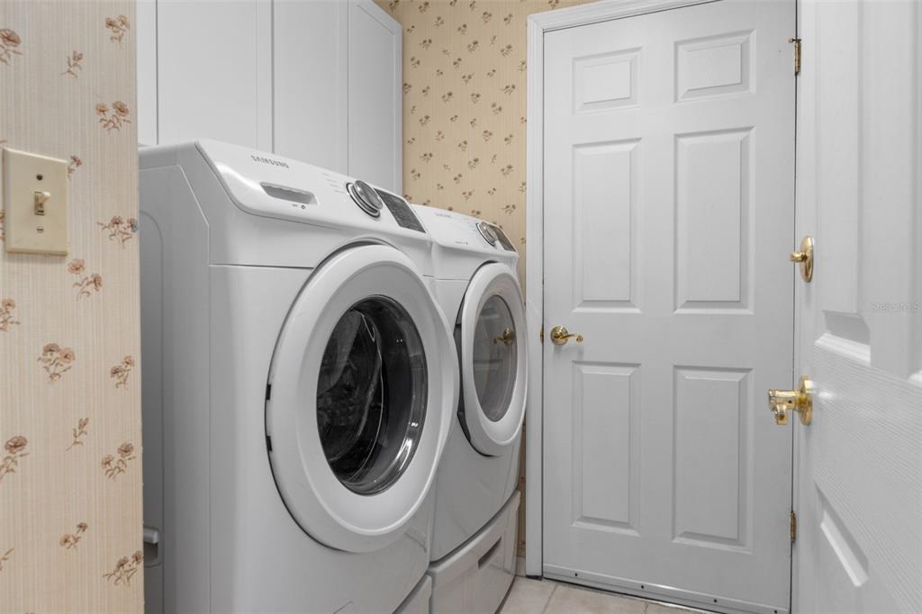 3217 Abeline Road Spring Hill, FL 34608 - Photo 32 of 48 a utility room with dryer and washer