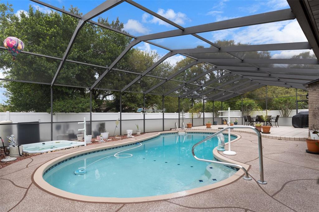 3217 Abeline Road Spring Hill, FL 34608 - Photo 43 of 48 a view of a swimming pool with a patio