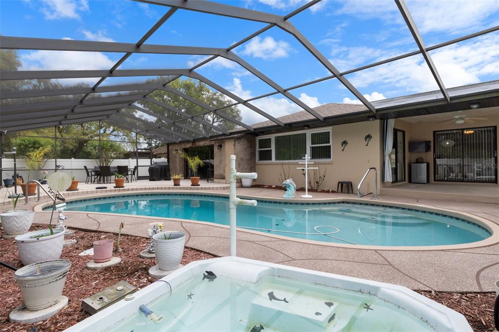 3217 Abeline Road Spring Hill, FL 34608 - Photo 44 of 48 a view of swimming pool with outdoor seating