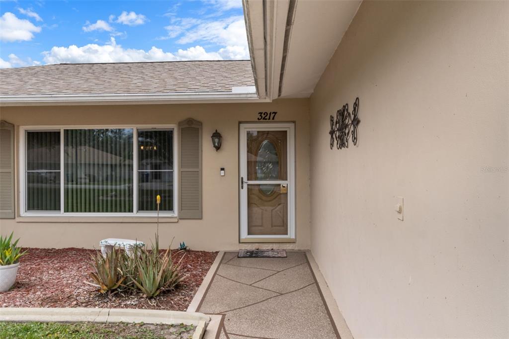 3217 Abeline Road Spring Hill, FL 34608 - Photo 7 of 48 a front view of a house with a window