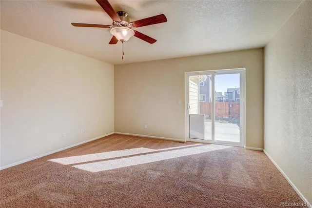 an empty room with fan