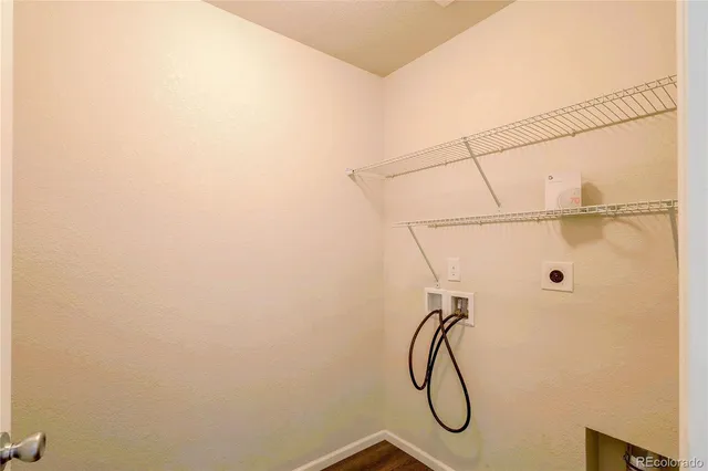 a view of a house with wooden fence