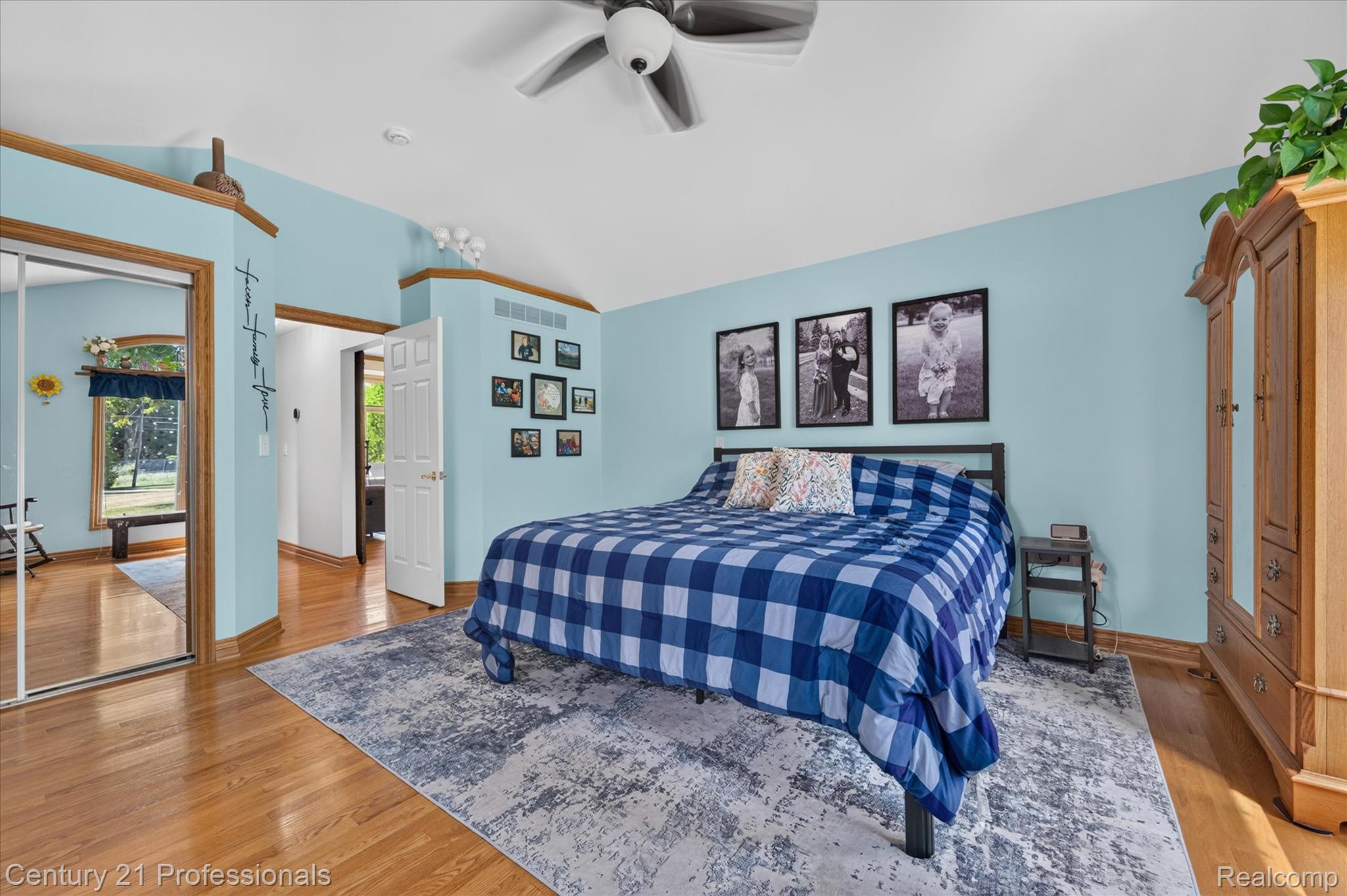 5675 36 Mile Road Romeo, MI 48065 - Photo 26 of 54 Spacious master bedroom with beautiful wood-finish flooring, vaulted ceilings, and a ceiling fan