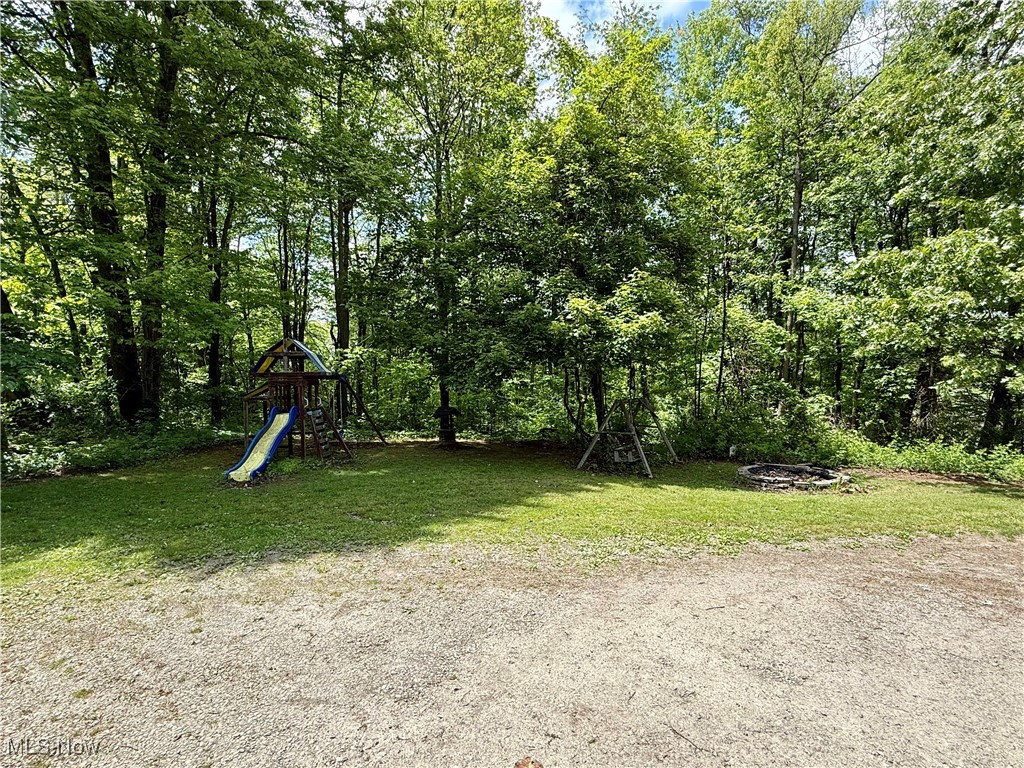 9400 Chalon Road Scio, OH 43988 - Photo 39 of 43 Rear view of house featuring a lawn and covered porch