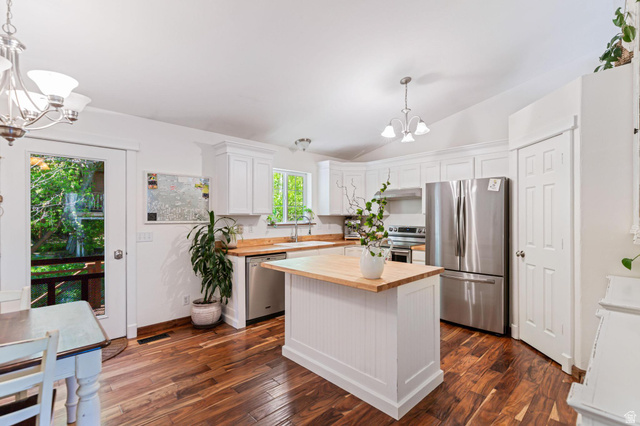 814 Mountain Road Logan, UT 84321 - Photo 2 of 42 Kitchen featuring wood-finish flooring, white cabinetry, wood countertops, and stainless steel appliances