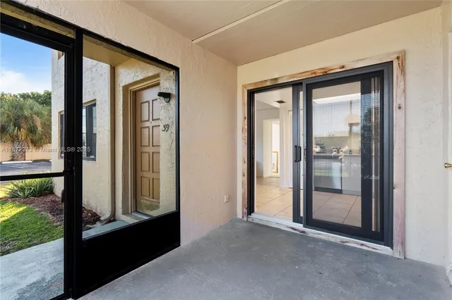 a view of a front door and outdoor space