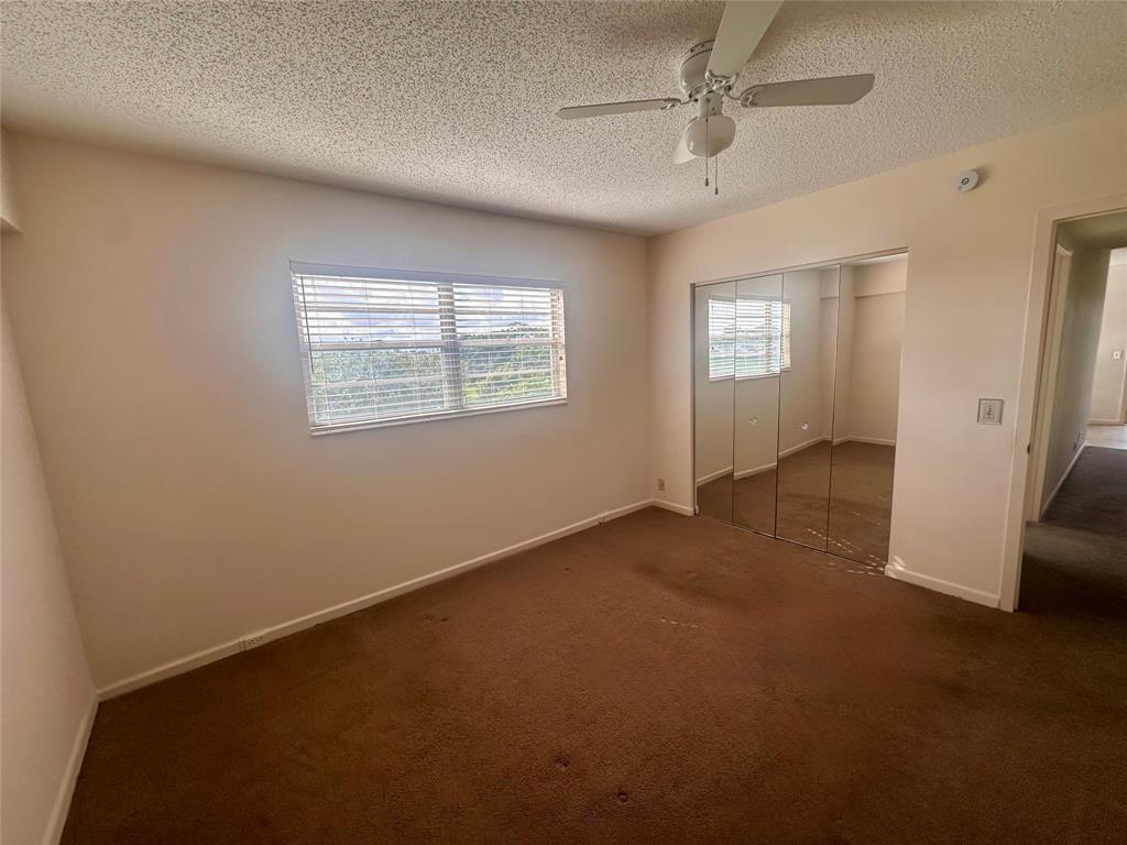 29 Preston A Boca Raton, FL 33434 - Photo 12 of 21 an empty room with windows and closet