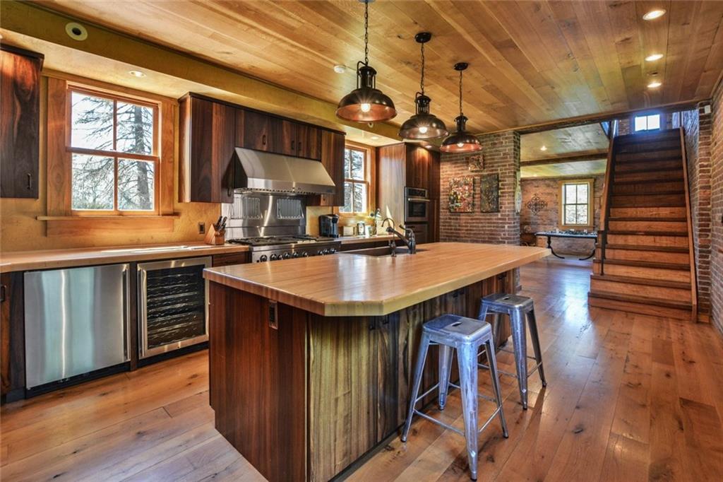 394 Game Farm Road New Castle, PA 16101 - Photo 2 of 25 Fabulous open concept chef's kitchen with high end appliances, gorgeous hardwood flooring and ceilings, and butcher block countertops.