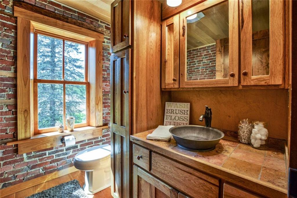 394 Game Farm Road New Castle, PA 16101 - Photo 13 of 25 The handcrafted vanities are made from solid wood with ceramic tops and copper sinks.