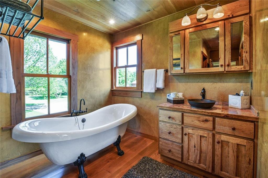 394 Game Farm Road New Castle, PA 16101 - Photo 15 of 25 The master bath has both a clawfoot tub and a spacious ceramic tile shower.