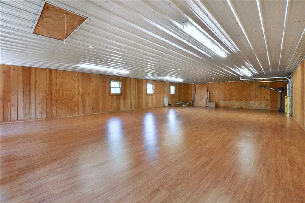 394 Game Farm Road New Castle, PA 16101 - Photo 18 of 25 This massive additional space resides above the garages and is accessed from stairs inside the garage. Wonderful party room, storage, dance floor, use your imagination!